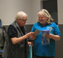 President Margaret with Caroline presenting a Rotary scarf and pin